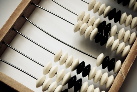 old abacus closeup on a grey backgroundの写真素材