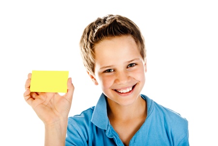 boy with yellow card isolated on a white backgroundの写真素材