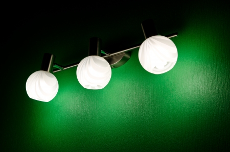 illuminated lamp on green background