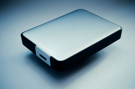hard disk on a blue background closeupの写真素材