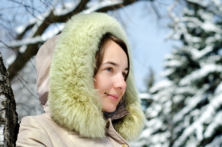 happy young woman in winter outdoors