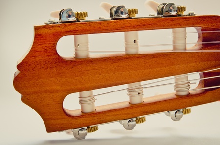 guitar fingerboard macro on a blue background