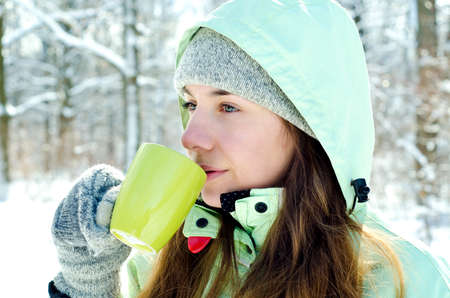 happy young woman in winter outdoors