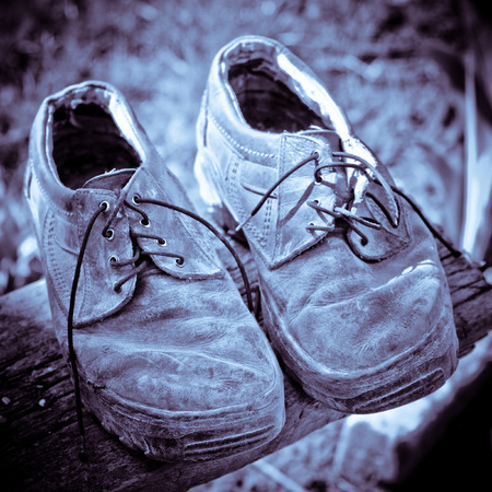 the pair of old shoesの写真素材