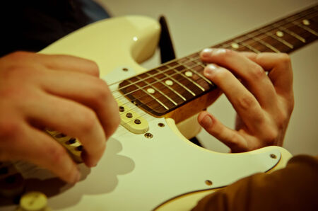 musician playing an electric guitarの写真素材