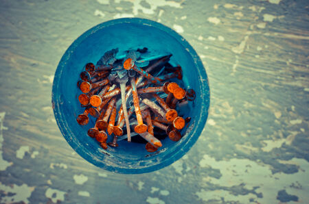 rusty nails on a grunge backgroundの写真素材