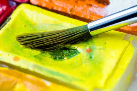 paint brush with watercolor paints macroの写真素材