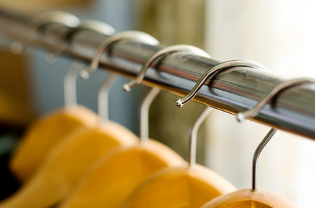 closeup of a lot of wooden hangersの写真素材