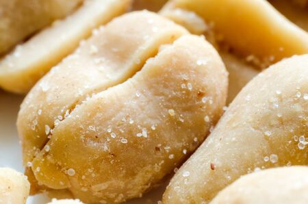 a lot of salty peanuts macroの写真素材