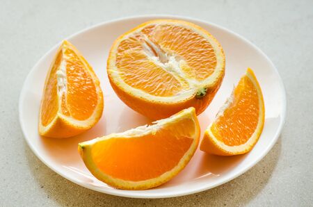 sliced oranges on a plate