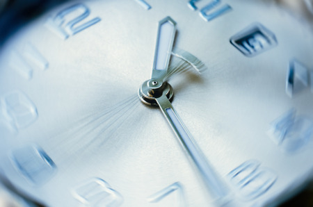 time concept of clock with moving hour handの写真素材