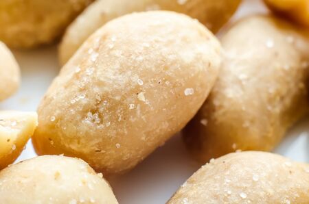 a lot of salty peanuts macroの写真素材