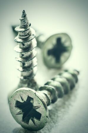 three metal screws macro closeupの写真素材