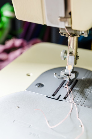 a needle of sewing machine closeup