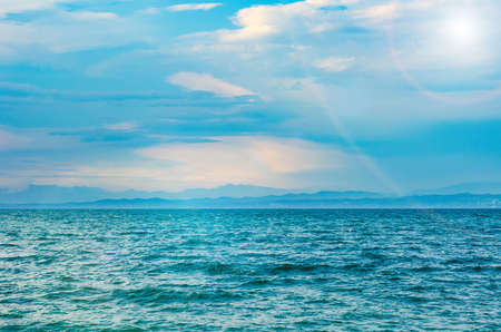 seascape with waves, sun and skyの写真素材