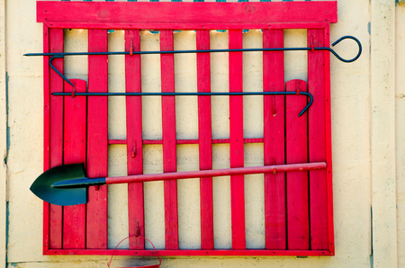 wooden fire shield with shovel, bucket, scrap and gaffの写真素材