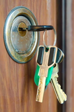 old key in door keyholeの写真素材