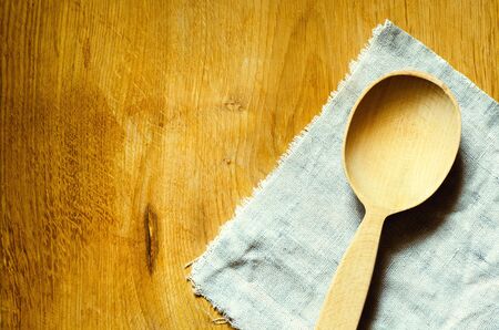 wooden spoon on the canvas backgroundの写真素材