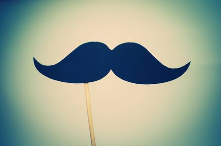 moustache mask on the stickの写真素材