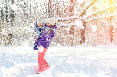 mother and baby in winter parkの写真素材