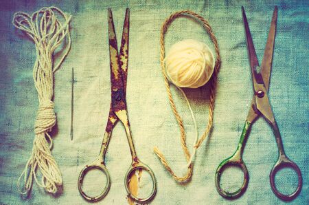 old sewing tools thread and rusty scissorsの写真素材