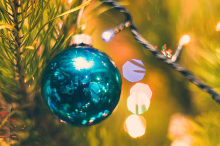 christmas toy ball with garland lights closeup