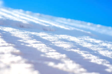 white snow and blue sky background