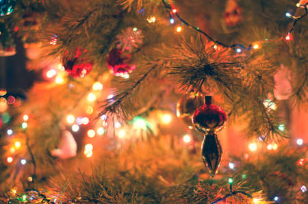 christmas tree with garland lights closeup backgroundの写真素材
