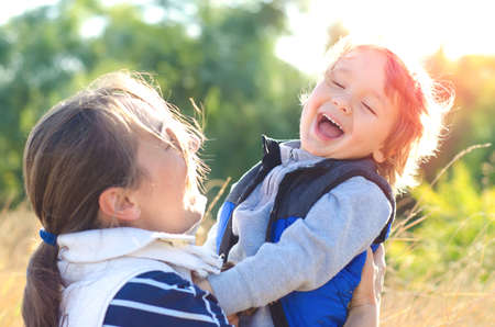 mother and child enjoy a walking outdoors
