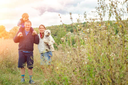 happy family enjoying weekend outdoorsの写真素材