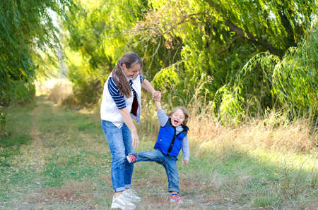 happy mother and baby playing outdoorsの写真素材