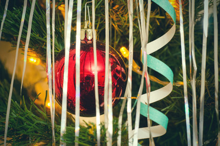 christmas tree ball with garland lights closeupの写真素材