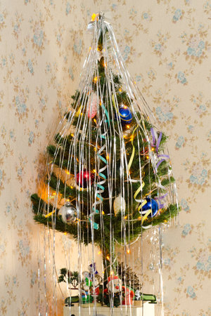 christmas tree with shining garland lightsの写真素材