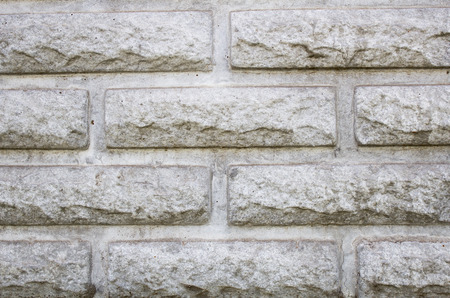 Gray bricks background, modern brick stylized under wild stone, brick wall