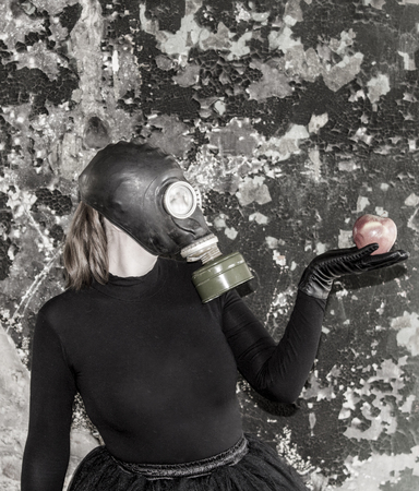 The girl in a gas mask. The threat of ecology. The idea of ââthe need to preserve the environmentの写真素材