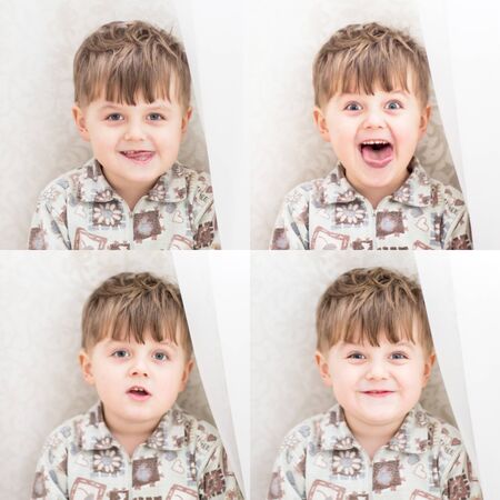 Little boy near a white curtains. Emotions. Emotions of a little boyの写真素材