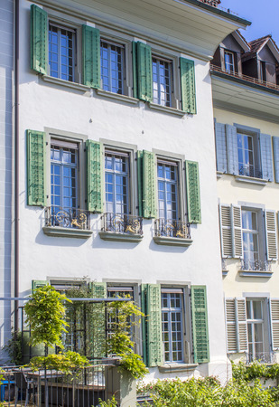 Old houses in Bern. Houses with flowers on the windows. Architecture of Bernの写真素材