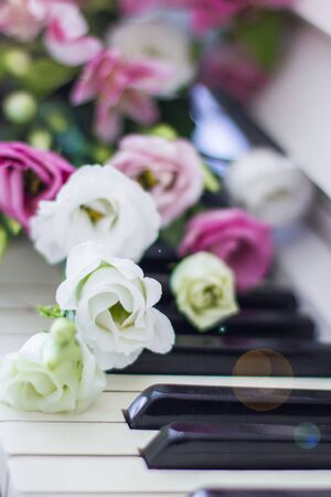 Bouquet of flowers. Flower Arrangement: Roses, Eustomas, Alstroemeria on the Pianoの写真素材