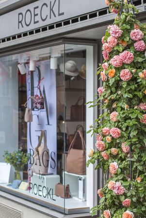 Zurich, Switzerland - 10, 05, 2018: Shop windows and flowers in Zurich. Street photo