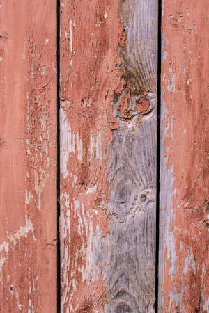 Wooden background with a shabby old paintの写真素材