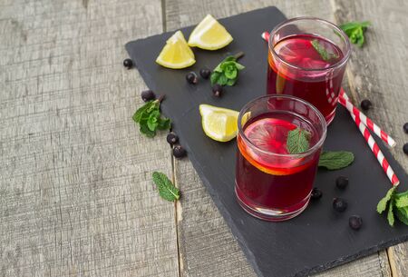 berry lemonade, refreshing summer beverage on a dark backgroundの写真素材