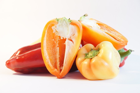 Red and yellow peppers on a white background is insulated. Vegetables on white.