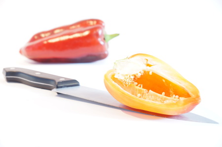 Red and yellow peppers on a white background is insulated. Vegetables on white.の写真素材