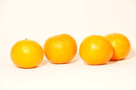 Ripe orange mandarins isolated on white backgroundの写真素材