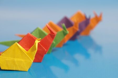 Paper origami snail isolated on a colorful backgroundの写真素材