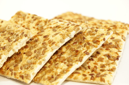 Dietary cookies with sesame seeds, flax and sunflower isolated on white background