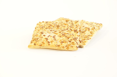 Dietary cookies with sesame seeds, flax and sunflower isolated on white backgroundの写真素材