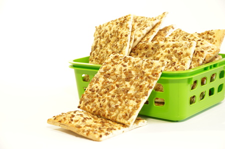 Dietary cookies with sesame seeds, flax and sunflower isolated on white backgroundの写真素材