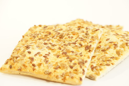 Dietary cookies with sesame seeds, flax and sunflower isolated on white background