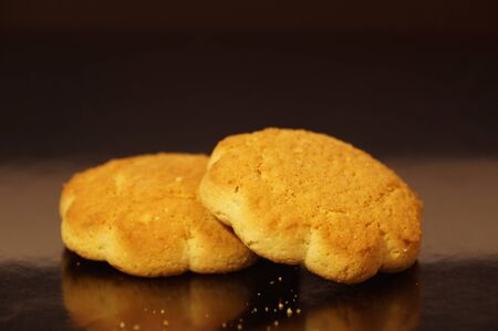 sweet corn cookies isolated on a dark backgroundの写真素材
